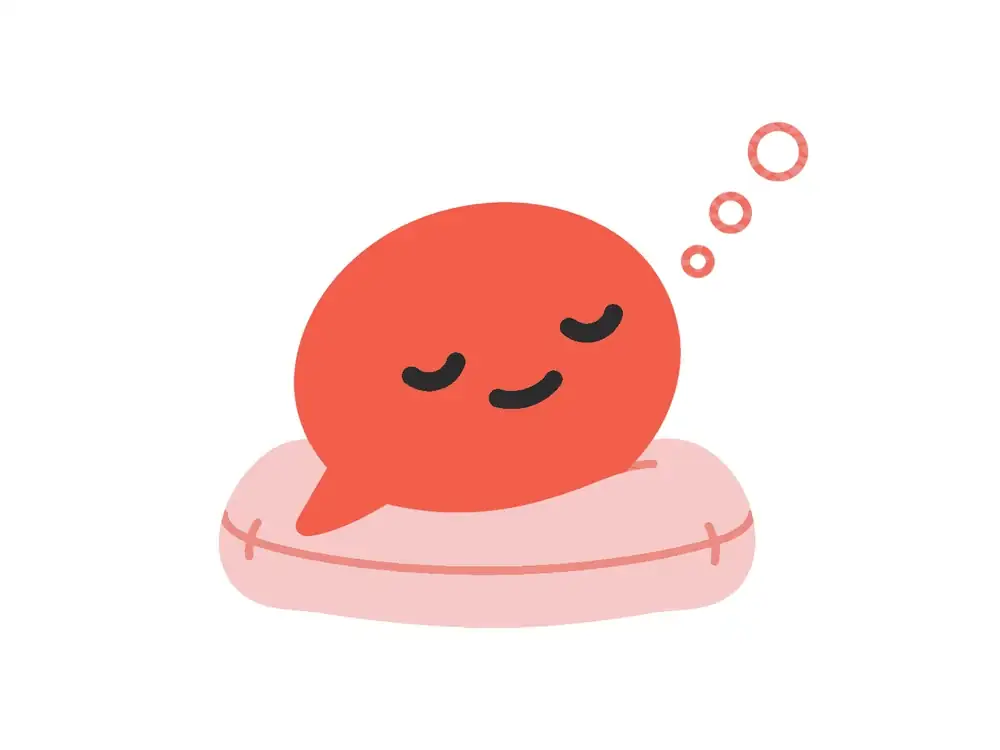 A cartoon coral speech bubble napping peacefully on a soft pink cushion
